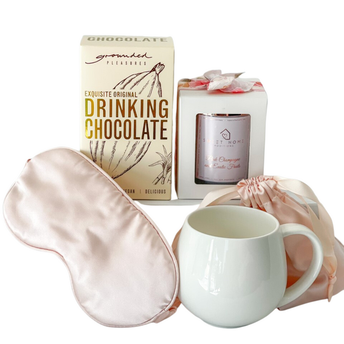 Serene gift hamper includes mug, drinking chocolate, sleep mask, candle