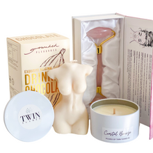 Load image into Gallery viewer, Indulge Gift Hamper. Rose quartz facial roller. Exquisite drinking chocolate. Soy tin candle hand poured in Melbourne. Sustainable wax, vegan and cruelty free. Available in Coastal breeze or French Pear randomly selected. 7.5cm in diameter.  Female torso candle, approximately 11 centimetres tall. Ideal for use as a centre piece or home decor.  Hand made in Sydney, unscented natural soy wax blend
