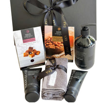 Load image into Gallery viewer, Black magnetic gift box with Charles Lee hand and body wash, Charles &amp; Lee moisturiser, Charles &amp; Lee face wash, Random Harvest assorted fudge, Random Harvest honey roasted peanuts and Sheridan face washer 
