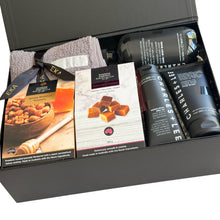 Load image into Gallery viewer, Black magnetic gift box with Charles Lee hand and body wash, Charles &amp; Lee moisturiser, Charles &amp; Lee face wash, Random Harvest assorted fudge, Random Harvest honey roasted peanuts and Sheridan face washer 
