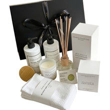 Load image into Gallery viewer, Black magnetic gift box with premium reed diffuser, soap bar, hand-poured candle, microfibre hand towel, Hand creme and hand wash. 
