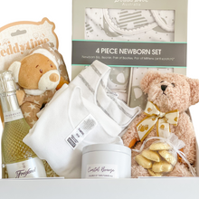 Load image into Gallery viewer, Congratulations Mum and Baby Gift Box  Included in this gift box:   Bubba Blue 4 Piece Newborn Set   Bonds Short Sleeve body suit Size 3-6 months (size 00)   Teddy Bear ring rattle (16cm)   Light brown teddy bear soft toy (20cm)   Soy candle tin by Twin Flames (Very Vanilla, French pear or coastal breeze randomly selected)   6 x Belgian chocolate hearts in gold   Presented in a white keepsake gift box and our signature blue satin ribbon 
